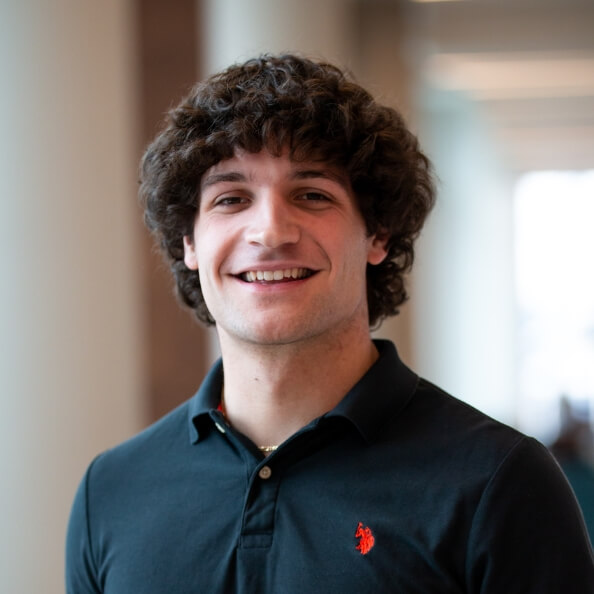 Bobby Schattle stands in an academic building.